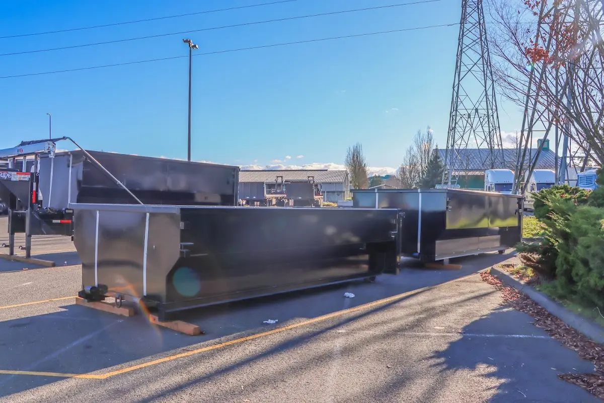 Roll-off dumpster ready for waste disposal at job site for Yard Waste Dumpster Rental in Brookhaven